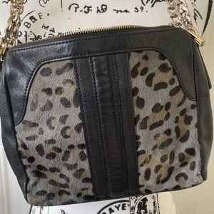 Kelsi Dagger black calf air animal print crossbody